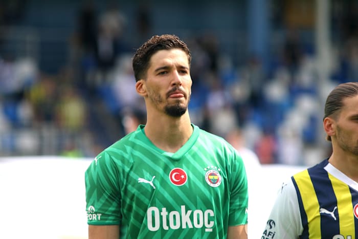 Goalkeeper Altay Bayindir pictured lining up before playing for Fenerbahce against Neftci Baku in July 2023